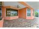 A beautiful patio with view to the pool and to the front door and interior of the house at 126 Peckham Sw St, Port Charlotte, FL 33952