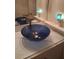Close-up of a marble bathroom sink and countertop with a contemporary faucet and sconces at 3380 Maple Ter, Port Charlotte, FL 33952