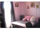 Pink bedroom with plushies and natural light at 3380 Maple Ter, Port Charlotte, FL 33952
