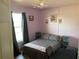 Cozy bedroom with pink walls and decor at 3380 Maple Ter, Port Charlotte, FL 33952
