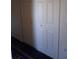 Hallway features white closet doors and carpet, offers ample storage space at 3380 Maple Ter, Port Charlotte, FL 33952