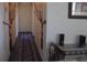 Hallway featuring carpet runner, decorative curtains, and a clean, well-maintained space at 3380 Maple Ter, Port Charlotte, FL 33952