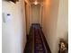 Bright hallway with a carpet runner and access to multiple rooms and closets at 3380 Maple Ter, Port Charlotte, FL 33952