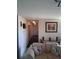 Cozy hallway with neutral walls, artwork, and leads to the living spaces at 3380 Maple Ter, Port Charlotte, FL 33952