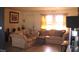 Comfortable living room features lots of natural light and cozy seating at 3380 Maple Ter, Port Charlotte, FL 33952