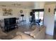 Bright living room showcases tile flooring, neutral decor, and an open layout at 3380 Maple Ter, Port Charlotte, FL 33952