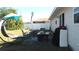 Inviting backyard patio area featuring comfortable seating, perfect for outdoor lounging and enjoying the serene surroundings at 3380 Maple Ter, Port Charlotte, FL 33952