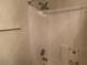 Clean shower features a chrome shower head, with white tiled walls and a soap dish at 3380 Maple Ter, Port Charlotte, FL 33952