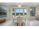 Cozy dining area with large windows overlooking the pool and patio area, perfect for entertaining at 5028 San Massimo Dr, Punta Gorda, FL 33950