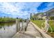 Private boat dock on the canal with a ladder for easy water access and boat lift at 5028 San Massimo Dr, Punta Gorda, FL 33950