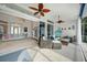 Inviting lanai with sliding doors features comfortable seating and ceiling fans at 5028 San Massimo Dr, Punta Gorda, FL 33950