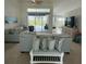 Spacious living room with a view of the outdoor pool and patio area at 5028 San Massimo Dr, Punta Gorda, FL 33950