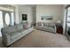 Bright living room featuring neutral tones, comfortable couches, and natural light, creating an inviting atmosphere at 5028 San Massimo Dr, Punta Gorda, FL 33950