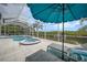 Enclosed pool deck with spa and view of mangrove waterway includes outdoor furniture for relaxing at 5028 San Massimo Dr, Punta Gorda, FL 33950