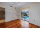 Bright bedroom with hardwood floors, ceiling fan, and sliding glass doors to the pool at 7352 Parkinsonia, Punta Gorda, FL 33955