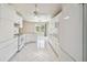 Clean bright kitchen featuring white cabinets, tile flooring, and stainless steel appliances at 1426 Natrona Dr, North Port, FL 34286