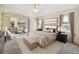 Serene primary bedroom with a sliding glass door, and relaxing sitting area at 1426 Natrona Dr, North Port, FL 34286