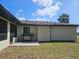 Backyard patio featuring a stainless steel grill on a sunny day at 18938 Ayrshire Cir, Port Charlotte, FL 33948