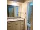 Bathroom vanity featuring granite countertop, white cabinets, and a modern sink at 18938 Ayrshire Cir, Port Charlotte, FL 33948