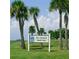 Port Charlotte Beach Park sign surrounded by lush green grass and palm trees on a clear day at 18938 Ayrshire Cir, Port Charlotte, FL 33948