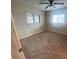 Bedroom featuring two windows for ample light, complemented by neutral paint and carpet at 18938 Ayrshire Cir, Port Charlotte, FL 33948