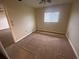 View of the bedroom revealing carpeted floors and a bright window, creating a welcoming atmosphere at 18938 Ayrshire Cir, Port Charlotte, FL 33948