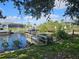 Private dock offers easy access to the waterfront, surrounded by lush greenery at 18938 Ayrshire Cir, Port Charlotte, FL 33948