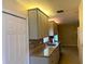 Kitchen features granite countertops, tile backsplash, stainless steel dishwasher, and white cabinetry at 18938 Ayrshire Cir, Port Charlotte, FL 33948