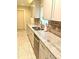 Kitchen features granite countertops, tile backsplash, stainless steel dishwasher, and white cabinetry at 18938 Ayrshire Cir, Port Charlotte, FL 33948