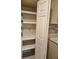 Organized pantry with shelves providing ample storage space in the kitchen at 18938 Ayrshire Cir, Port Charlotte, FL 33948
