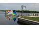 Sailboats with colorful sails moored in a calm harbor, reflecting on the tranquil water's surface at 18938 Ayrshire Cir, Port Charlotte, FL 33948