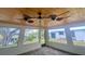 The inviting sunroom with wood ceiling, tile floors, and plenty of natural light through large windows at 18938 Ayrshire Cir, Port Charlotte, FL 33948