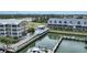 An aerial view of a waterfront community with pool, boat docks, and buildings at 1960 Oregon Trl # 2B, Englewood, FL 34224