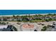 Aerial perspective showing the area surrounding the roundabout, including the beach, businesses and green spaces at 1960 Oregon Trl # 2B, Englewood, FL 34224