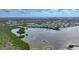 Wide aerial view of neighborhood and waterfront property with condo community along the intercoastal waterway at 1960 Oregon Trl # 2B, Englewood, FL 34224