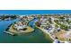 Coastal community aerial showcasing waterfront properties, canal access, and scenic views of the bay and ocean at 1960 Oregon Trl # 2B, Englewood, FL 34224
