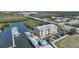 Aerial view of a condominium complex, with the community pool and boat docks at 1960 Oregon Trl # 2B, Englewood, FL 34224
