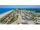 Elevated shot showcasing a roundabout surrounded by local businesses and beautiful beach and island scenery at 1960 Oregon Trl # 2B, Englewood, FL 34224
