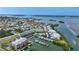 Beautiful aerial view of waterfront condos with a boat dock, pool and view of the ocean and surrounding neighborhood at 1960 Oregon Trl # 2B, Englewood, FL 34224