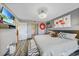 Spacious bedroom with elegant decor, attached tv, and ensuite bathroom at 1960 Oregon Trl # 2B, Englewood, FL 34224