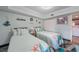 This bright bedroom features two beds and nautical decor at 1960 Oregon Trl # 2B, Englewood, FL 34224
