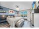 Stylishly decorated bedroom with ample natural light and calming gray tones at 1960 Oregon Trl # 2B, Englewood, FL 34224