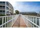Community bridge view of two building exteriors at 1960 Oregon Trl # 2B, Englewood, FL 34224