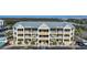Well-maintained condo building with a new metal roof, balconies, and private stairway access at 1960 Oregon Trl # 2B, Englewood, FL 34224
