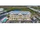 Exterior shot of condo building, swimming pool, parking lot and boat dock surrounded by the water in a bay at 1960 Oregon Trl # 2B, Englewood, FL 34224