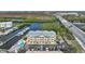 Exterior shot of condo building, swimming pool, parking lot and boat dock surrounded by the water in a bay at 1960 Oregon Trl # 2B, Englewood, FL 34224
