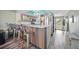 Updated kitchen boasts stainless appliances, trendy breakfast bar, and direct access to front entry at 1960 Oregon Trl # 2B, Englewood, FL 34224