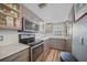 Galley kitchen offers stainless appliances and ample counter space at 1960 Oregon Trl # 2B, Englewood, FL 34224