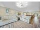 Open-concept living room with cozy furniture at 1960 Oregon Trl # 2B, Englewood, FL 34224