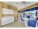 Comfortable outdoor area with ceiling fan, sink, white cabinets, and seating at 1960 Oregon Trl # 2B, Englewood, FL 34224